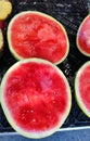 Unmarked beautifully colored sliced Ã¢â¬â¹Ã¢â¬â¹watermelons on store shelves in a supermarket Royalty Free Stock Photo